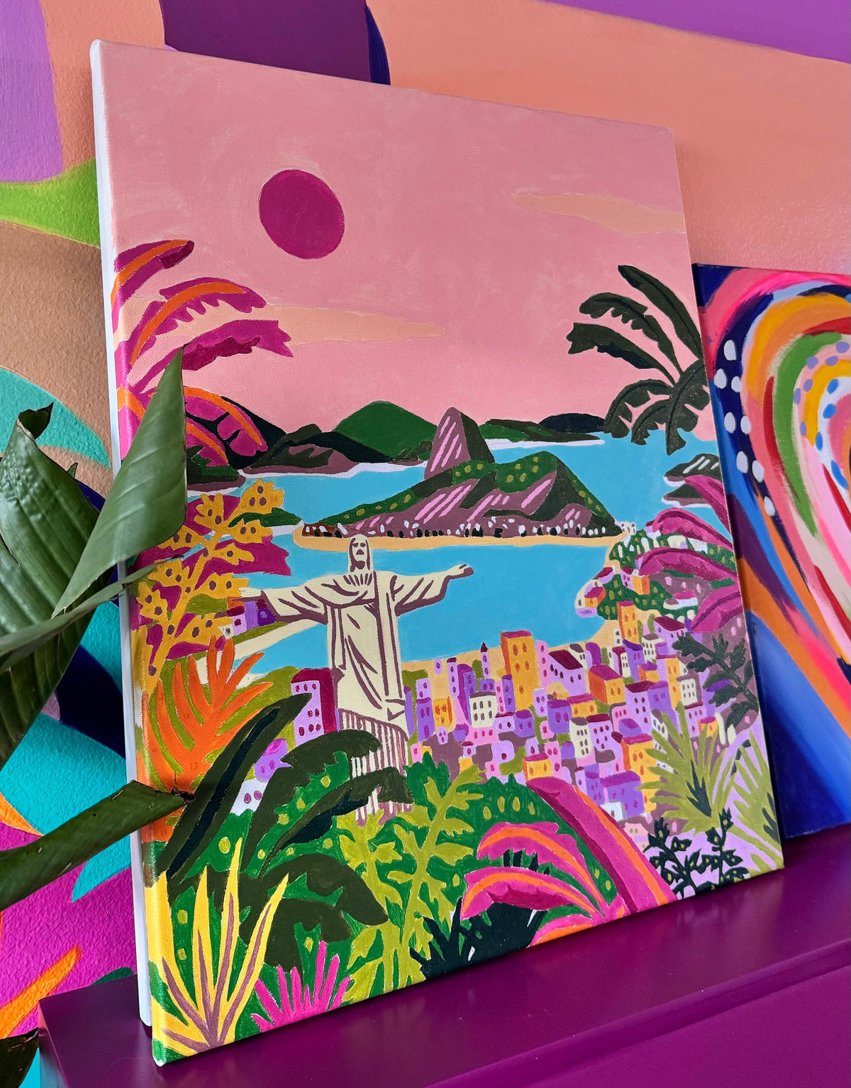 Lienzo con pintura por números de paisaje brasileño colorido con Cristo Redentor y montañas al atardecer.